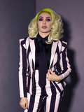 Micheline Pitt wearing a Beetlejuice inspired outfit highlighted by the Bowie Blouse w/Matching Tie in Black Charmeuse.