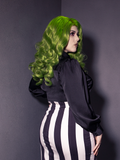 Green-haired model turned away from the camera to provide a side and back shot of the Bowie Blouse w/Matching Tie in Black Charmeuse.