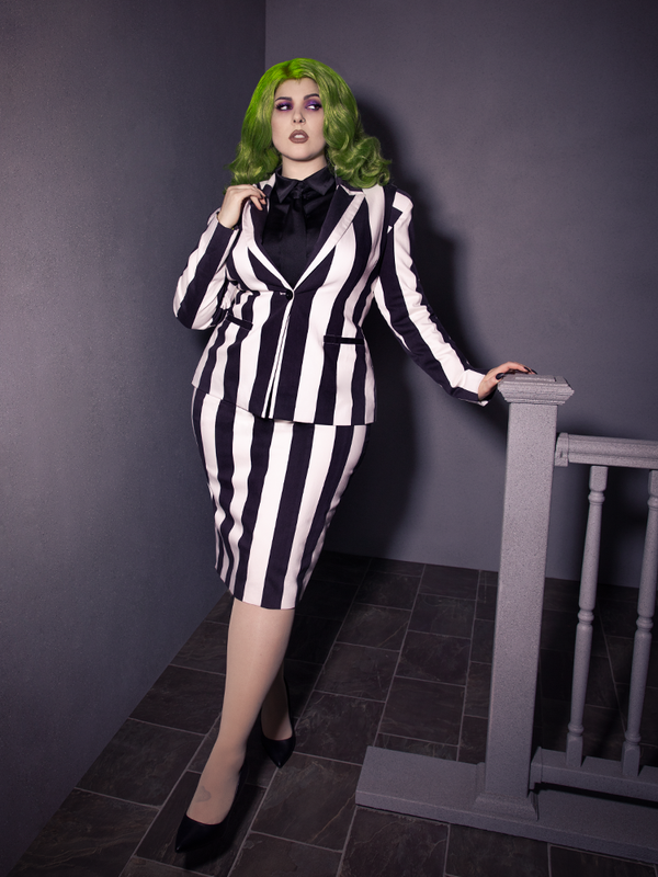 Full length shot of female model in a black and white pinstripe outfit Bowie Blouse w/Matching Tie in Black Charmeuse.