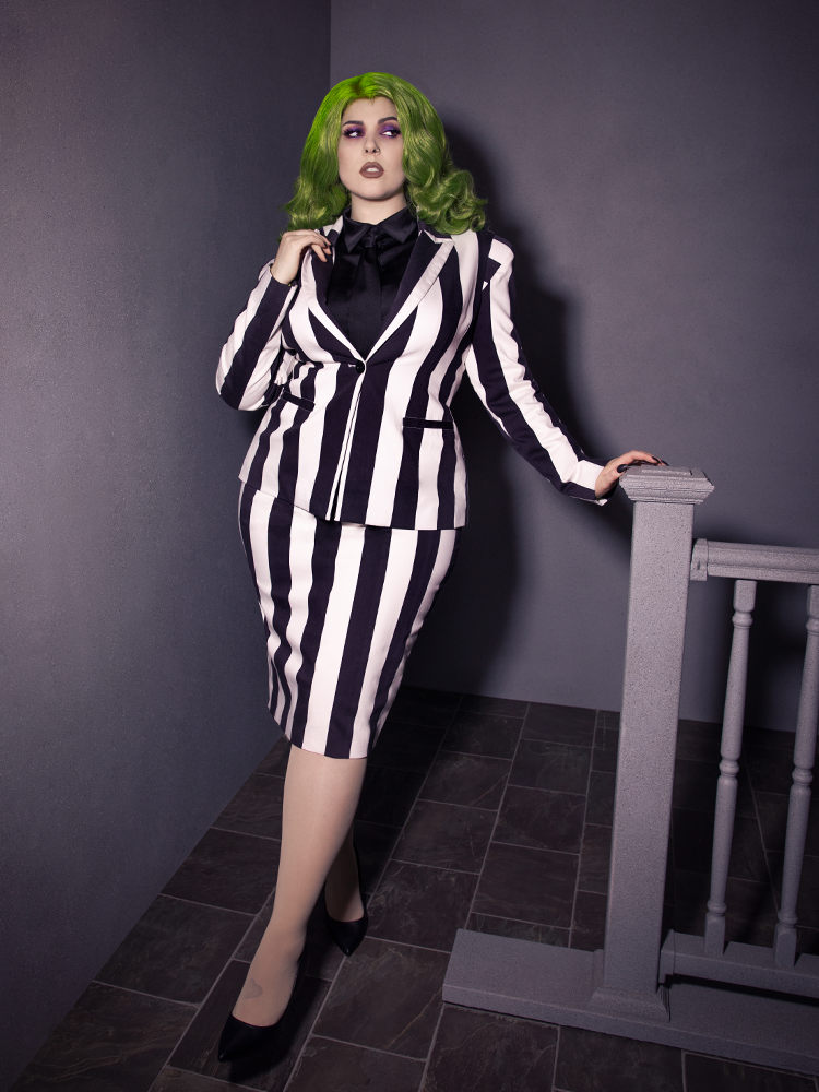 Full length shot of female model in a black and white pinstripe outfit Bowie Blouse w/Matching Tie in Black Charmeuse.