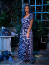 The Tim Burton's CORPSE BRIDE™ Butterfly Maxi Dress in Dusk Blue worn by model standing in an outdoor setting.