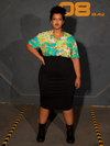 Full length shot of female plus-size model wearing the ALIEN Space Souvenir Button Up Shirt tucked into a black skirt.