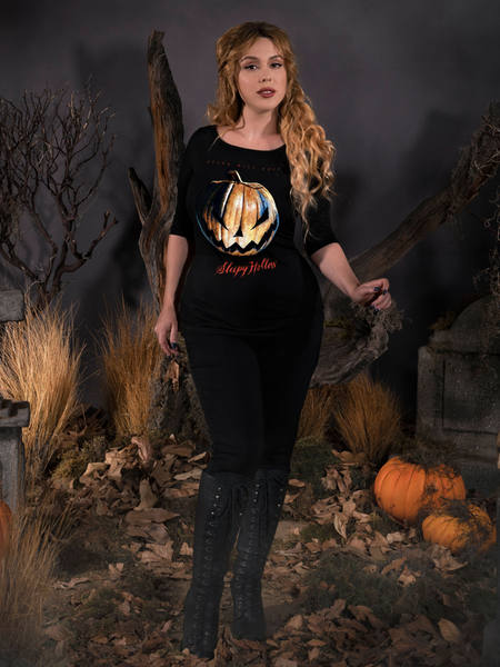 Full length shot of Linda wearing a goth style outfit including the Sleepy Hollow™ Carved Pumpkin 3/4 Sleeve Tee.