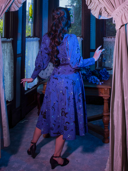 Ashley Thomson turns away from the camera while wearing the  Tim Burton's CORPSE BRIDE™ Beyond the Veil Dress in Novelty Print to show off the back.