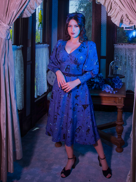 Placing her hands together at her waist, Ashley Thomson stuns in the all-new  Tim Burton's CORPSE BRIDE™ Beyond the Veil Dress in Novelty Print from La Femme en Noir.