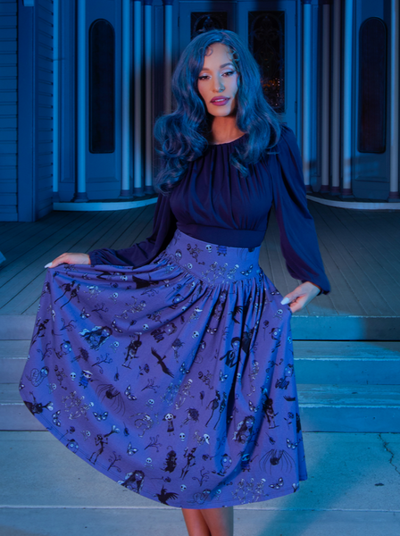 Full length shot of model showing off her gothic retro look highlighted by the Salem Top in Navy. All items available from La Femme en Noir.