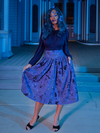 With a butterfly adorned veil draped over her face, Vanessa shows off the goth inspired skirt she's modeling from La Femme en Noir.
