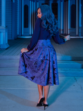 Vanessa turned away from the camera to show off the back of the gothic inspired skirt named the Tim Burton's CORPSE BRIDE™ Gothic Tales Skirt in Beyond the Veil Print.