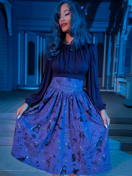 Close up of the Salem Top in Navy worn with the corpse bride print skirt being worn by model.