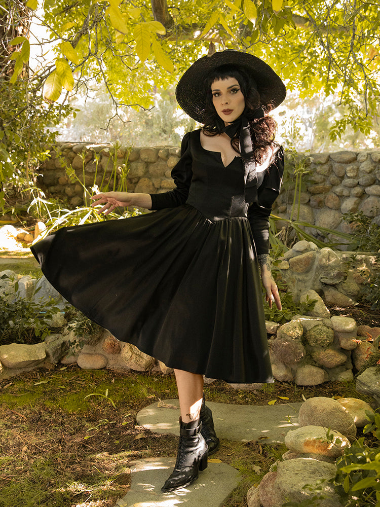 Twirling her dress around, Stephanie shows off the newest gothic style dress release from La Femme en Noir - the Cottage Witch Dress in Japanese Black Satin.