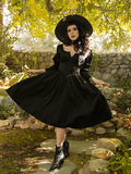 Stephanie twirls the skirt on her Cottage Witch Dress in Japanese Black Satin from La Femme en Noir.