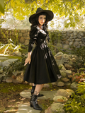 Side profile shot of Stephanie wearing the Cottage Witch Dress in Japanese Black Satin.