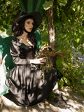 The Cottage Witch Dress in Japanese Black Satin as worn by Stephanie for gothic retro clothing company La Femme en Noir.