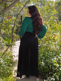 Rachel Sedory turned away from the camera to show off the back of her Crawford Palazzo Pants in Black.