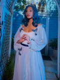 Vanessa looks off-camera while wearing Tim Burton's CORPSE BRIDE™ Emily Butterfly Gown in Celestial Blue.