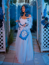 Vanessa holding the Emily bag while wearing Tim Burton's CORPSE BRIDE™ Emily Butterfly Gown in Celestial Blue to tie the outfit totally together.