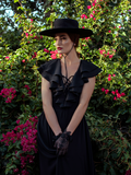 Aliza photographed in black lace gloves, black sunhat and the Mythical Goddess Gown in Black.