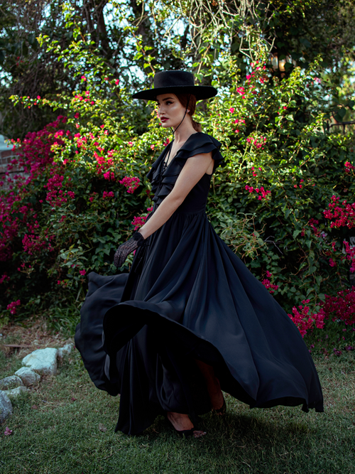 Aliza twirls in the Mythical Goddess Gown in Black.