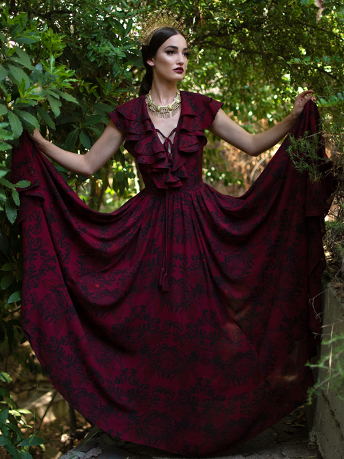 Aliza wearing the Mythical Goddess Gown in Oxblood Gorgon Print from gothic clothing brand La Femme en Noir.