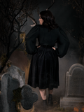 The back of the Sleepy Hollow Gothic Tales Velour Skirt in Black worn by Rachel from La Femme en Noir.