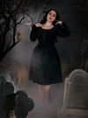 Full length shot of Rachel Sedory wearing a gothic inspired dress.