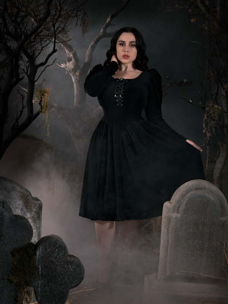 Rachel pulling out the side of her Sleepy Hollow Gothic Tales Velour Swing Dress.