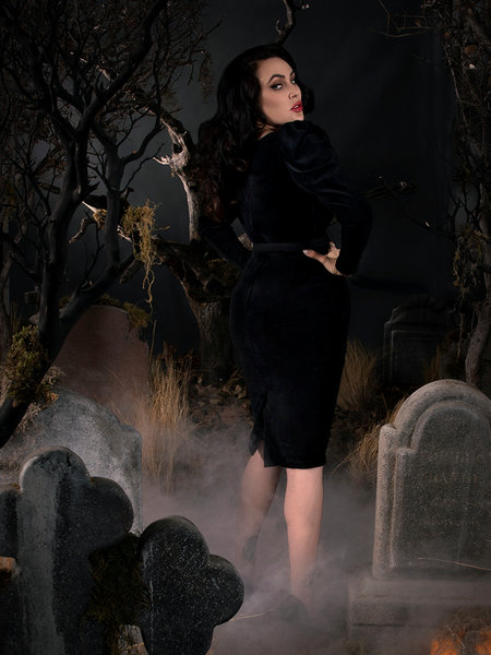 Micheline Pitt showing off the back of her gothic retro dress.