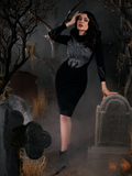 Micheline Pitt wearing a black gothic dress from Sleepy Hollow named Sleepy Hollow Hessian Dress in Black.