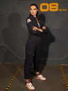 KJ standing with her arms crossed while wearing the ALIEN Ripley Flight Suit in Navy.