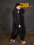 Profile shot of KJ wearing the ALIEN Ripley Flight Suit in Navy from gothic glamour clothing brand La Femme en Noir.