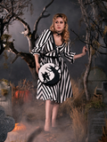 Linda standing in a foggy cemetery while modeling a gothic retro dress paired with the Sleepy Hollow purse.