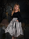 Linda, standing in a foggy graveyard, models the Sleepy Hollow The Katrina Skirt in Black and White from La Femme en Noir.