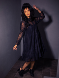 The BEETLEJUICE™ Darkroom Dress from La Femme en Noir suits this stunning female model perfectly.