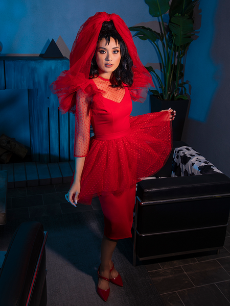 Model holding out the sides of the skirt on the BEETLEJUICE™ Lydia Dress.