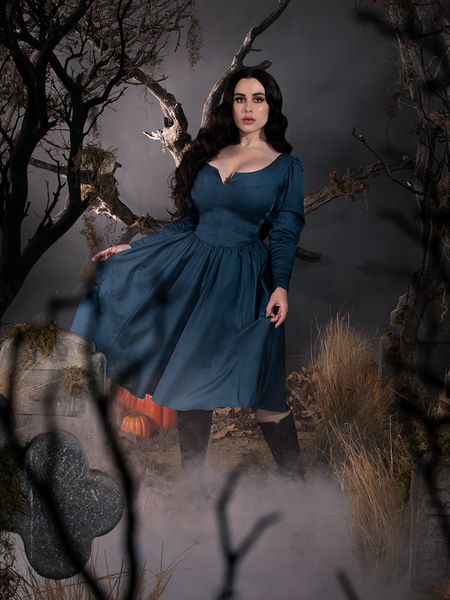 Rachel pulls out the fabric on her Sleepy Hollow The Lady Crane Dress in Vintage Blue to show off the beautiful skirt color.