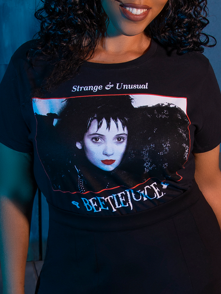 Close-up on the design of the front of the BEETLEJUICE™ Lydia Dead Tee from gothic glamour company La Femme en Noir.