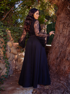 The back of the Mythical Maxi Skirt in Black Chiffon being worn by Ashley Thomson.