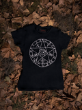 A closeup photo of the Sleepy Hollow™ Protection Spell Tee on the floor with dead leaves.