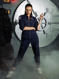 Standing in front a foggy metal door, KJ models the ALIEN Ripley Flight Suit in Navy from La Femme en Noir.