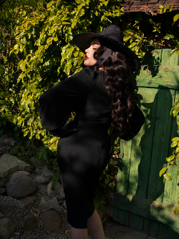 The back of the Salem Top in Black as worn by Micheline Pitt.