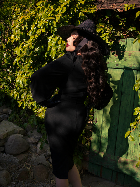 The back of the Salem Top in Black as worn by Micheline Pitt.