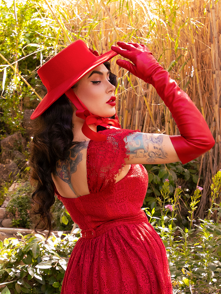 Back shot of Micheline Pitt wearing the Southern Gothic Bustier Top in Crimson from gothic clothing retailer La Femme en Noir.