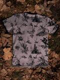 A closeup of the back of the Sleepy Hollow™ Toile Ringer Tee on the ground with dead leaves.