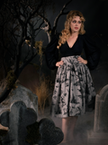 Full length goth skirt being worn by Linda in a spooky, foggy graveyard. 