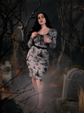 Full body length shot of Rachel in the Sleepy Hollow Gothic Tales Toile Wiggle Dress in Grey from La Femme en Noir.