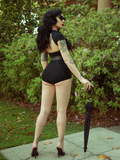 Micheline Pitt showing off the backside of the Glamour Ghoul Swimsuit.