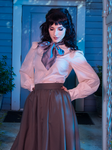 Model poses in a gothic style outfit featuring The Edwardian Blouse With Cravat. 