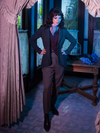 Full length shot of Stephanie standing in an old Victorian foyer while wearing the Tim Burton's CORPSE BRIDE™ Victor Peplum Blazer in Spruce Green.