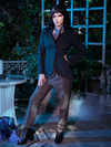 Stephanie posing with the buttons clasped on her Tim Burton's CORPSE BRIDE™ Victor Peplum Blazer in Spruce Green. 