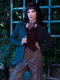 Stephanie wearing the Tim Burton's CORPSE BRIDE™ Victor Peplum Blazer in Spruce Green with a vest and vintage goth pants to create a classic Victorian gothic outfit.